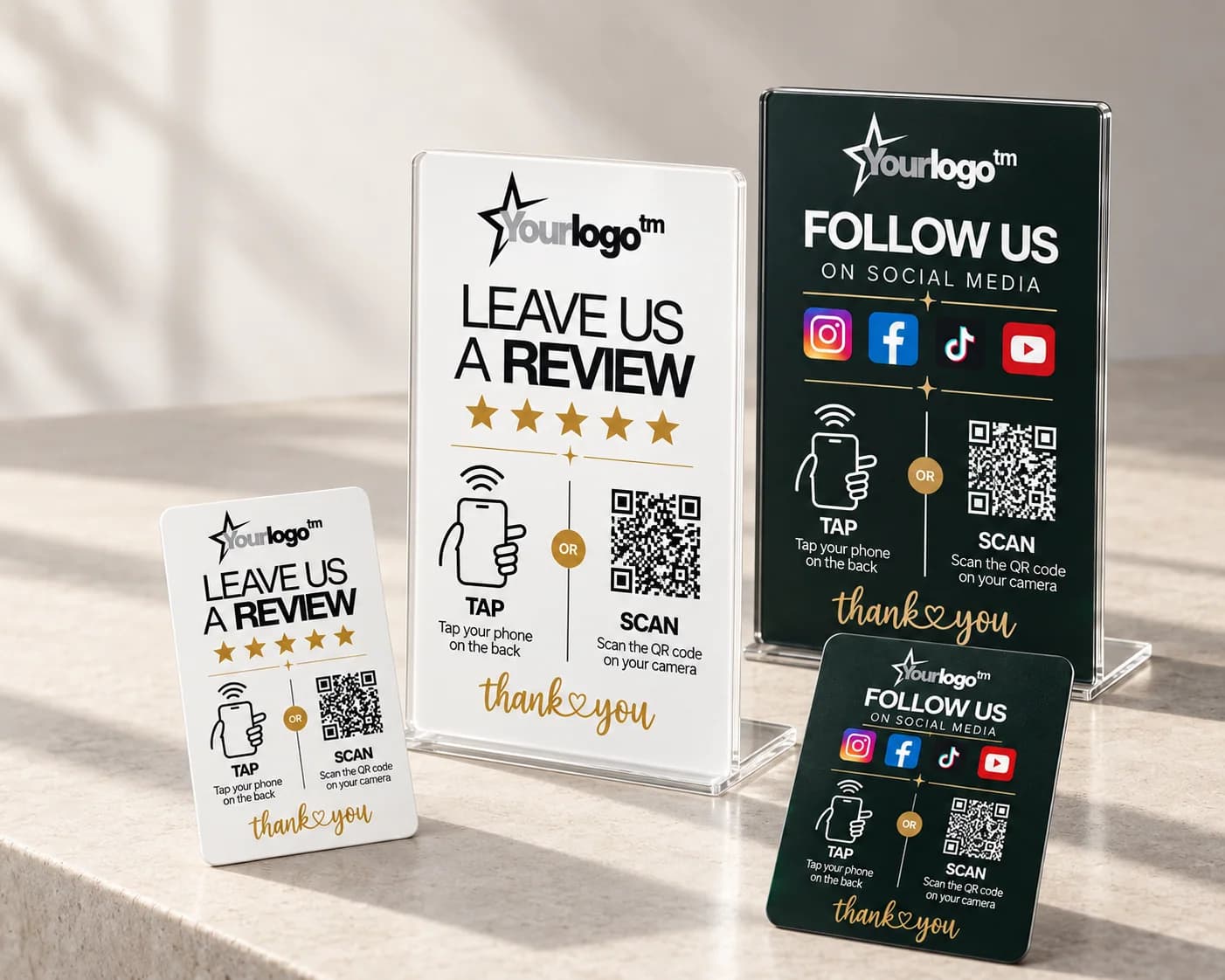 Personalised QRTAP review stands and NFC cards arranged in a premium studio setting